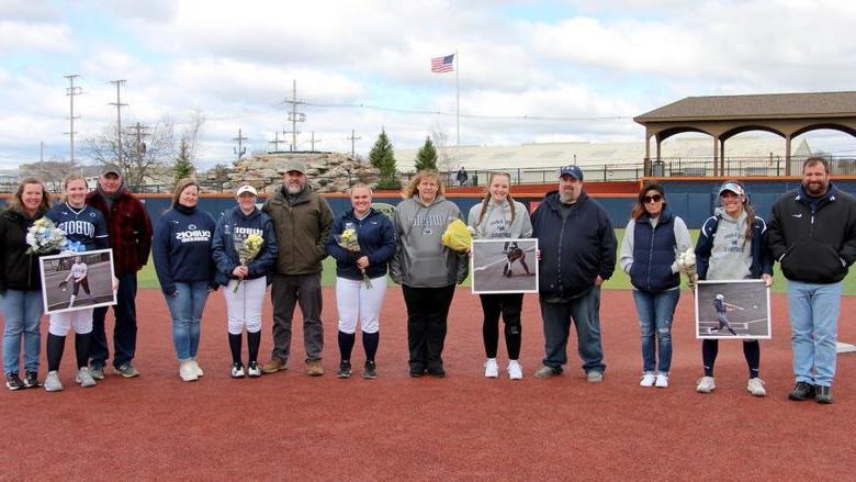 The members of the softball team at Penn State 杜波依斯 who were recognized, along with their family members, during senior day recognition.