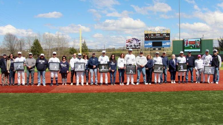 The senior members of the baseball team at Penn State 杜波依斯, along with their family members, during their senior day recognition at Showers Field in 杜波依斯.